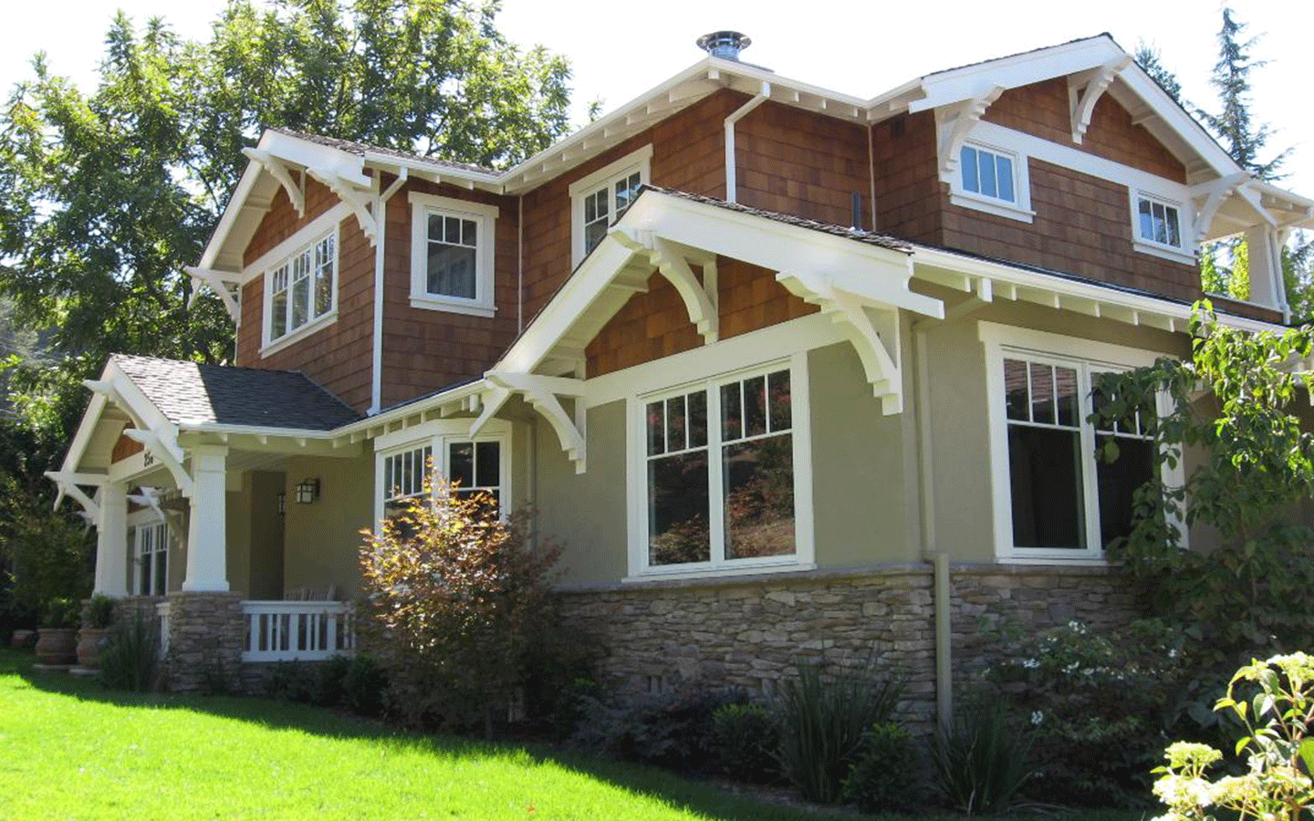 Angled photo of a two-story home with detailed architectural features