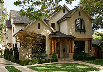 Front view of a two-story home with multiple gables and detailed porch features