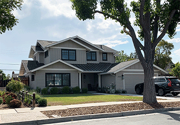 Front view of a two-story home with an artistic grouping of gables
